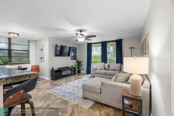 6193 ROCK ISLAND RD APT 101, TAMARAC, FL 33319 - Image 1