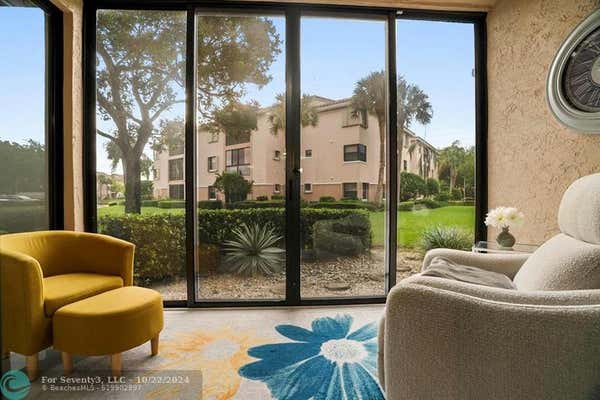 4161 CORAL TREE CIR APT 165, COCONUT CREEK, FL 33073 - Image 1