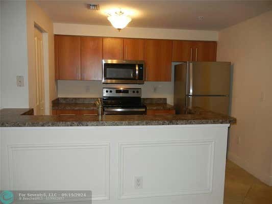 5940 W SAMPLE RD APT 302, CORAL SPRINGS, FL 33067 - Image 1