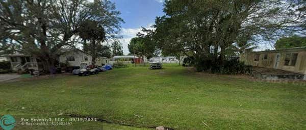 214 ORCHARD AVE NW, MOORE HAVEN, FL 33471 - Image 1