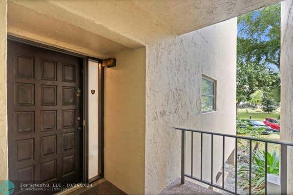 6060 S FALLS CIRCLE DR APT 207, LAUDERHILL, FL 33319 - Image 1