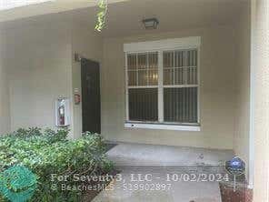 5880 W SAMPLE RD APT 104, CORAL SPRINGS, FL 33067 - Image 1