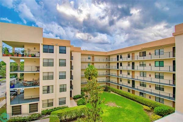 6193 ROCK ISLAND RD APT 418, TAMARAC, FL 33319 - Image 1