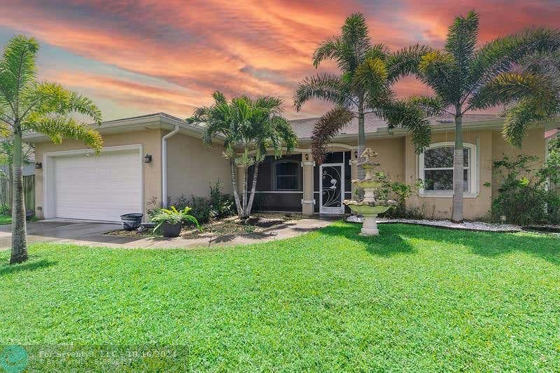 5842 NW BATES AVE, PORT ST LUCIE, FL 34986, photo 1 of 27