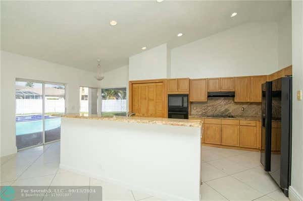 13141 NW 8TH CT, SUNRISE, FL 33325, photo 4 of 34