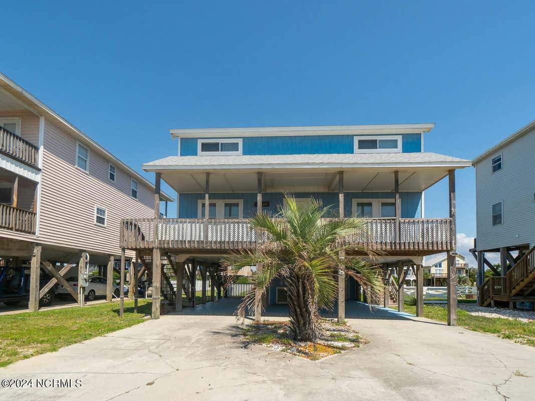 718 W BEACH DR, OAK ISLAND, NC 28465, photo 1 of 42