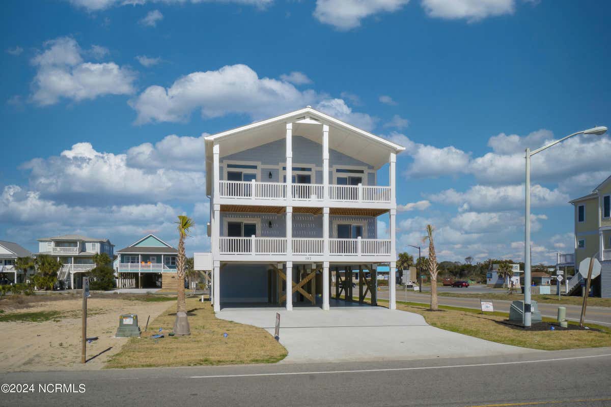 102 W BEACH DR, OAK ISLAND, NC 28465, photo 1 of 50