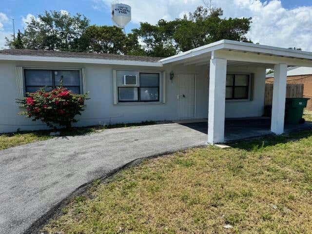 5707 BRIARWOOD ST, MANGONIA PARK, FL 33407, photo 1 of 40