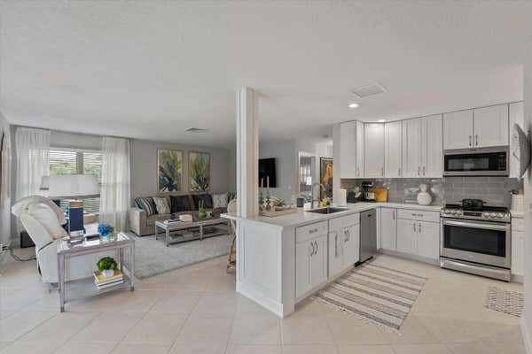 320 VILLA DR S, ATLANTIS, FL 33462 - Image 1