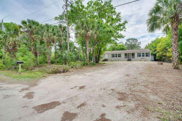 7570 SW RATTLESNAKE RUN, PALM CITY, FL 34990 - Image 1