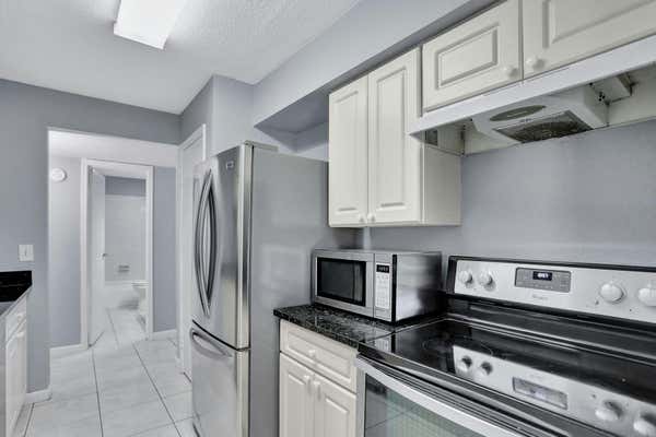 899 RIVERSIDE DR APT 610, CORAL SPRINGS, FL 33071 - Image 1