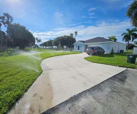 156 DABOU LOOP, BELLE GLADE, FL 33430 - Image 1