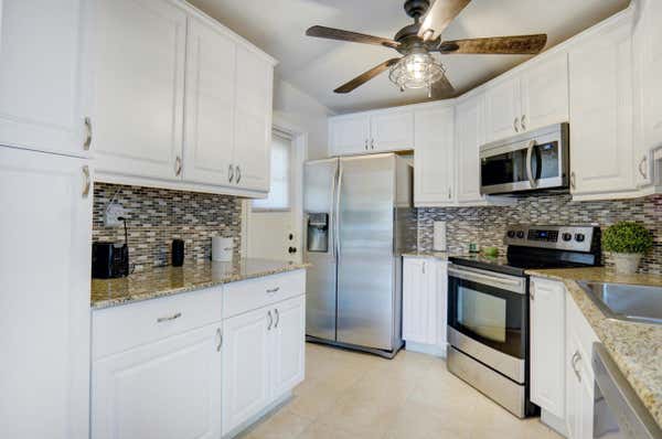 4 GREENWAY VLG N UNIT 101, ROYAL PALM BEACH, FL 33411 - Image 1