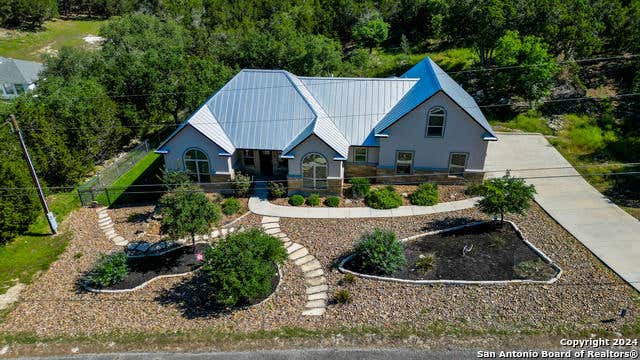 1005 FLAMAN RD, CANYON LAKE, TX 78133, photo 1 of 50