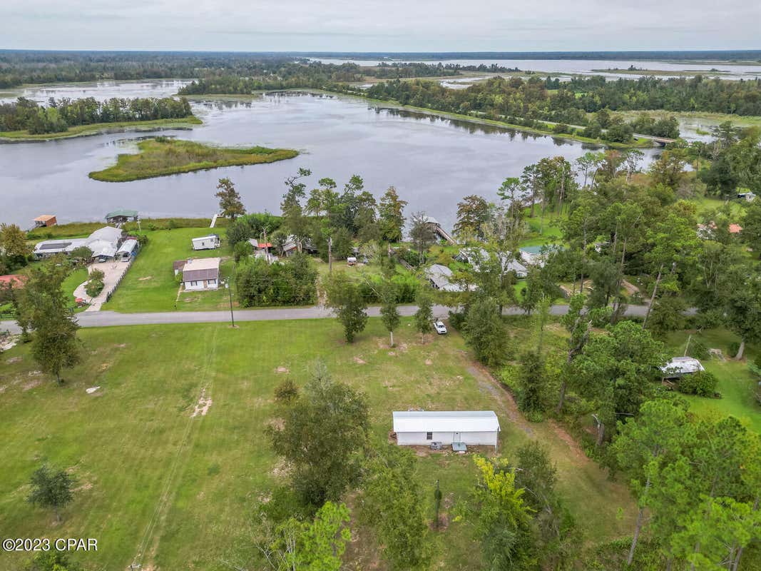 7815 LAKE SEMINOLE RD, SNEADS, FL 32460, photo 1 of 14