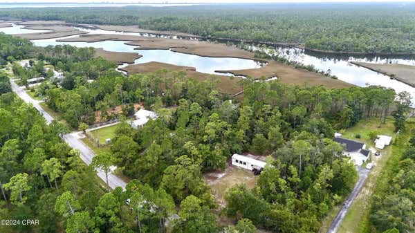 9507 S BURNT MILL CREEK RD, SOUTHPORT, FL 32409, photo 3 of 37