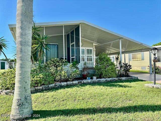 427 PUFFIN DR, BAREFOOT BAY, FL 32976, photo 1 of 29