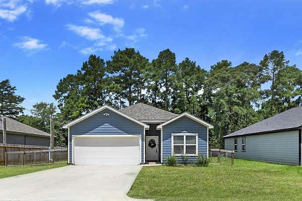 11242 MAGNOLIA DR, PLANTERSVILLE, TX 77363 - Image 1