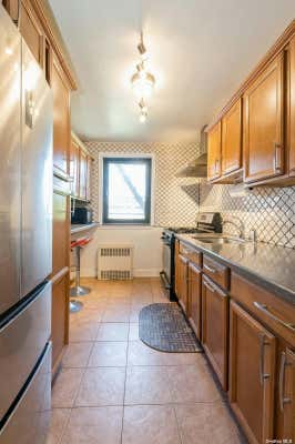 8719 204TH ST APT A55, HOLLIS, NY 11423, photo 3 of 15