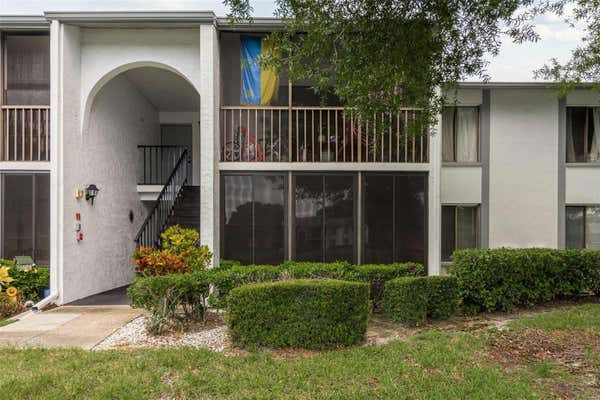 1207 PINE RIDGE CIR W APT F1, TARPON SPRINGS, FL 34688 - Image 1