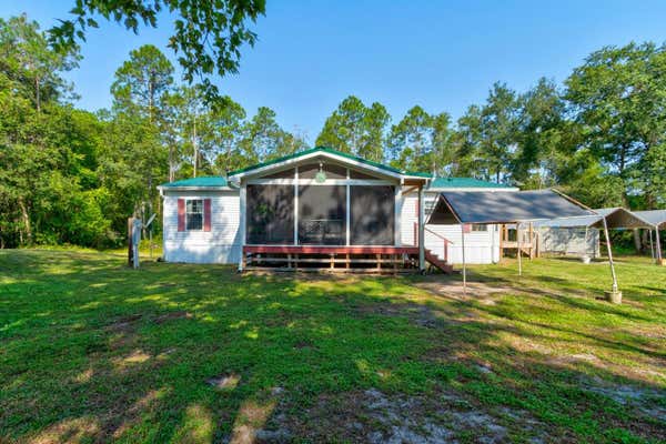 301 DEEP CREEK BRANCH RD, DE LEON SPRINGS, FL 32130 - Image 1