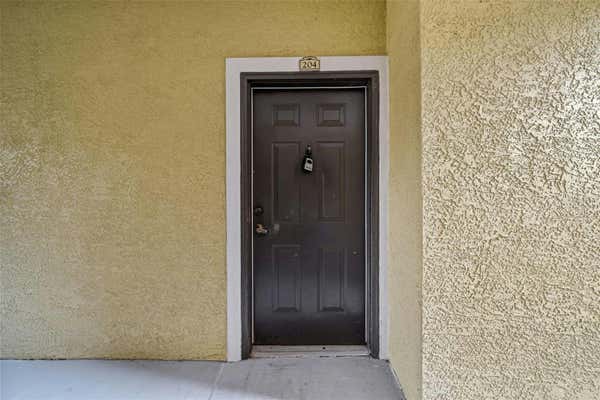 9918 COURTNEY PALMS BLVD APT 204, TAMPA, FL 33619, photo 2 of 37