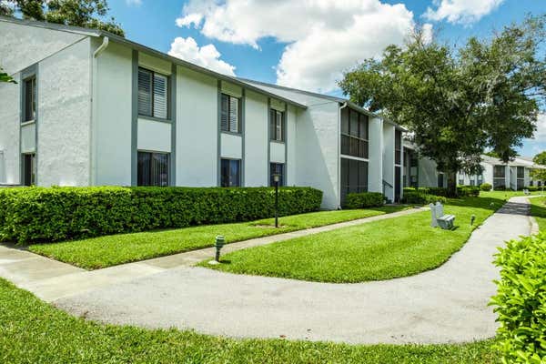 1109 PINE RIDGE CIR W APT G1, TARPON SPRINGS, FL 34688 - Image 1