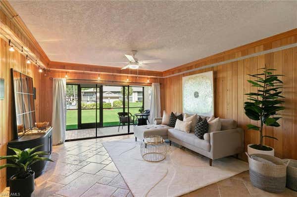 256 PEBBLE BEACH CIR APT D104, NAPLES, FL 34113 - Image 1