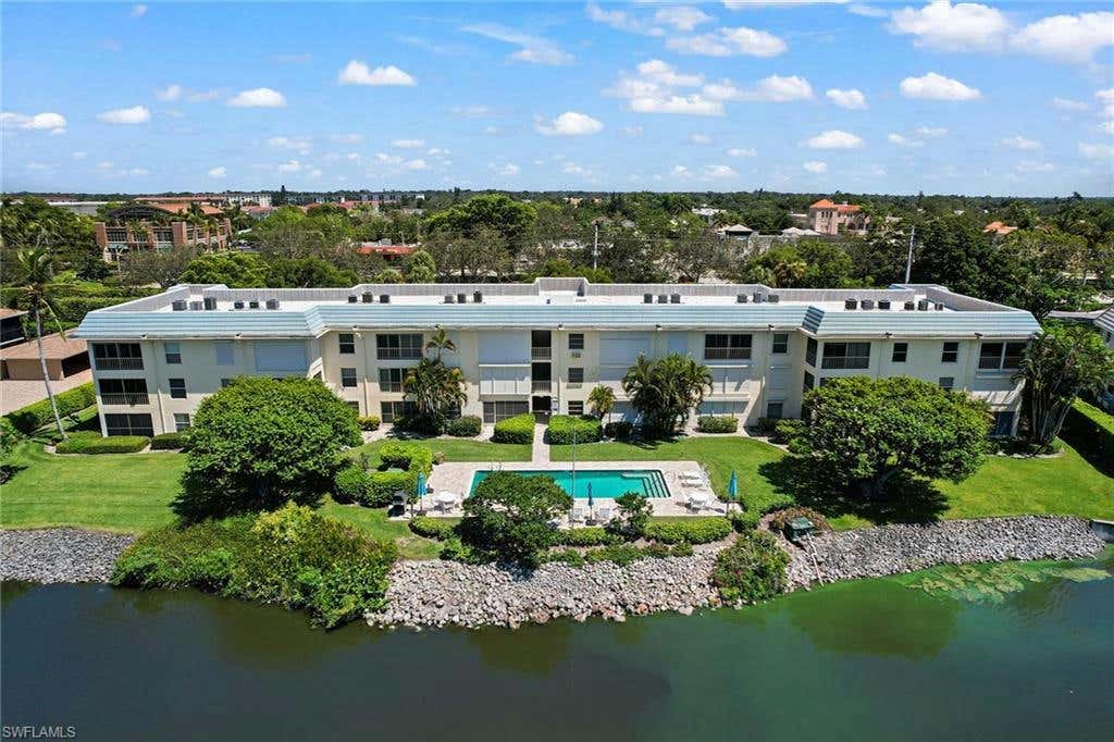 3055 RIVIERA DR APT 103, NAPLES, FL 34103, photo 1 of 21