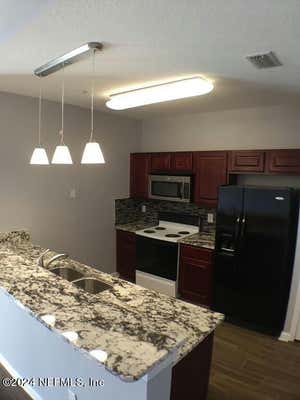 8235 LOBSTER BAY CT UNIT 305, JACKSONVILLE, FL 32256 - Image 1