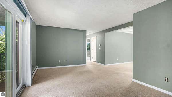 525 GEORGETOWN DR APT 70, TRAVERSE CITY, MI 49684, photo 3 of 28