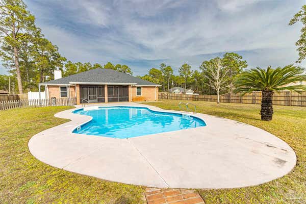 6977 LEISURE ST, NAVARRE, FL 32566, photo 1 of 60