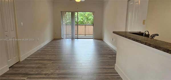 5860 W SAMPLE RD APT 201, CORAL SPRINGS, FL 33067 - Image 1