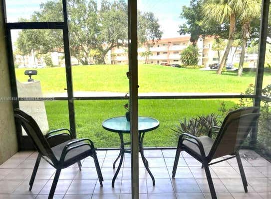 611 S HOLLYBROOK DR APT 102, PEMBROKE PINES, FL 33025 - Image 1