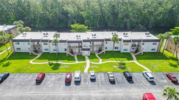 110 LAKE MERYL DR APT 213, WEST PALM BEACH, FL 33411 - Image 1