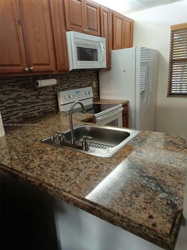 10402 SUNRISE LAKES BLVD APT 201, SUNRISE, FL 33322, photo 1 of 16