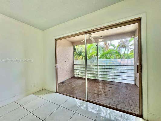 8605 W SAMPLE RD APT 209, CORAL SPRINGS, FL 33065 - Image 1